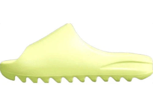 "adidas Yeezy Slide x Glow Green – vibrant neon-green slide with soft EVA foam, minimalist design, and ridged outsole for comfort and traction."