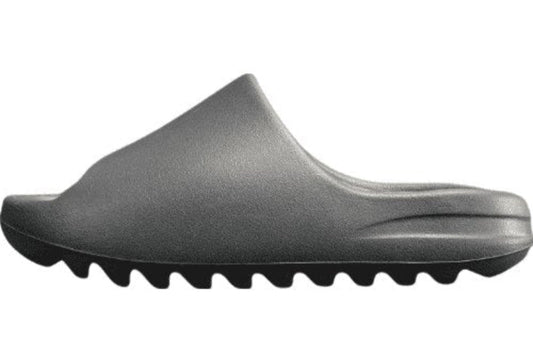 "adidas Yeezy Slide x Onyx – sleek all-black slide with soft EVA foam, minimalist design, and ridged outsole for comfort and grip."
