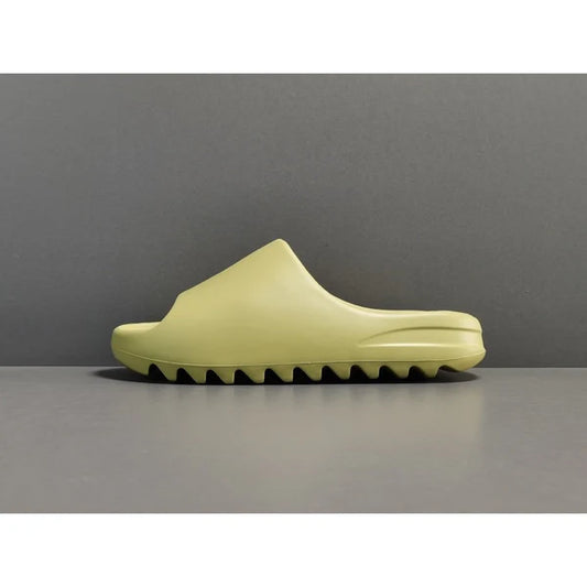 "adidas Yeezy Slide x Resin – earthy green slide with soft EVA foam, minimalist design, and ridged outsole for comfort and traction."