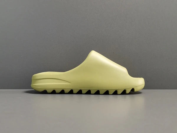 "adidas Yeezy Slide x Resin – earthy green slide with soft EVA foam, minimalist design, and ridged outsole for comfort and traction."
