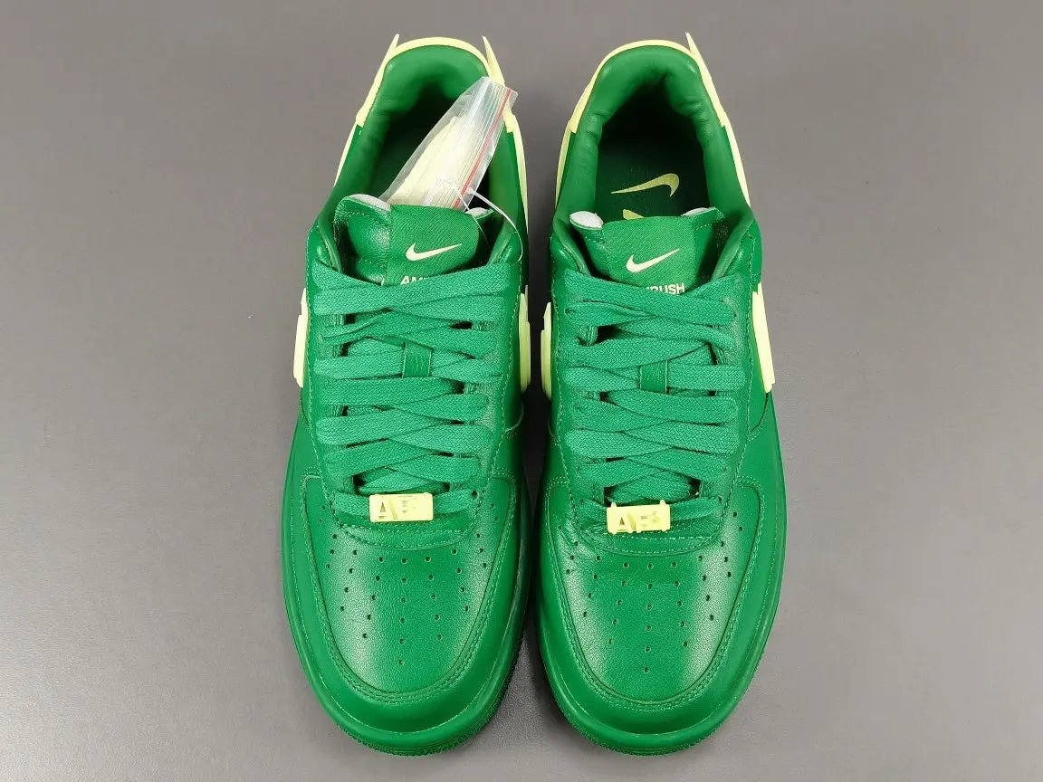 Nike Air Force 1 x AMBUSH Pine Green sneaker with oversized Swoosh design
