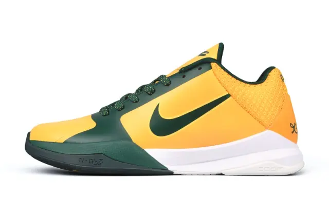 A Nike athletic shoe in yellow and green with a white midsole, shown in a side profile on a white background.
