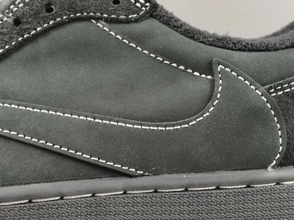 "Jordan 1 Low Travis Scott Phantom with black nubuck, white stitching, and signature reverse Swoosh."