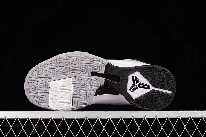Heel detail of Nike Kobe 5 Protro White/Black basketball shoes highlighting the black heel counter, external support, and clean white-to-black color blocking