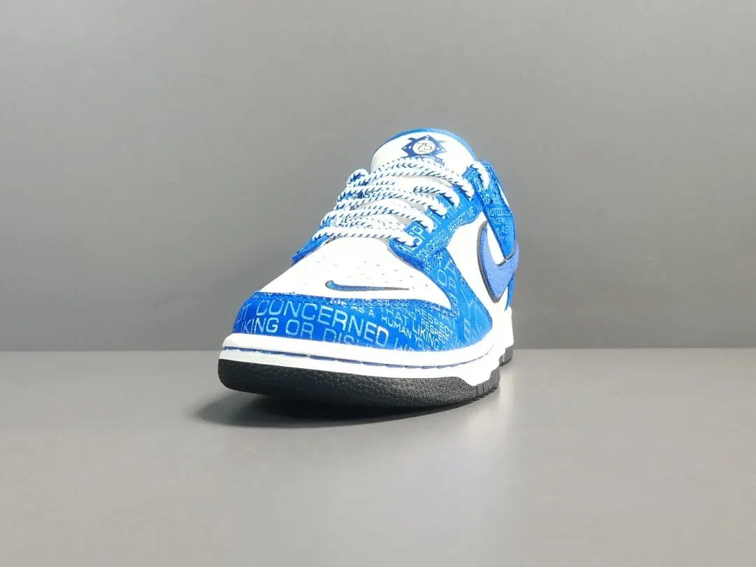 Nike Dunk Low “Jackie Robinson” sneaker with black, grey, and royal blue accents honoring the baseball legend
