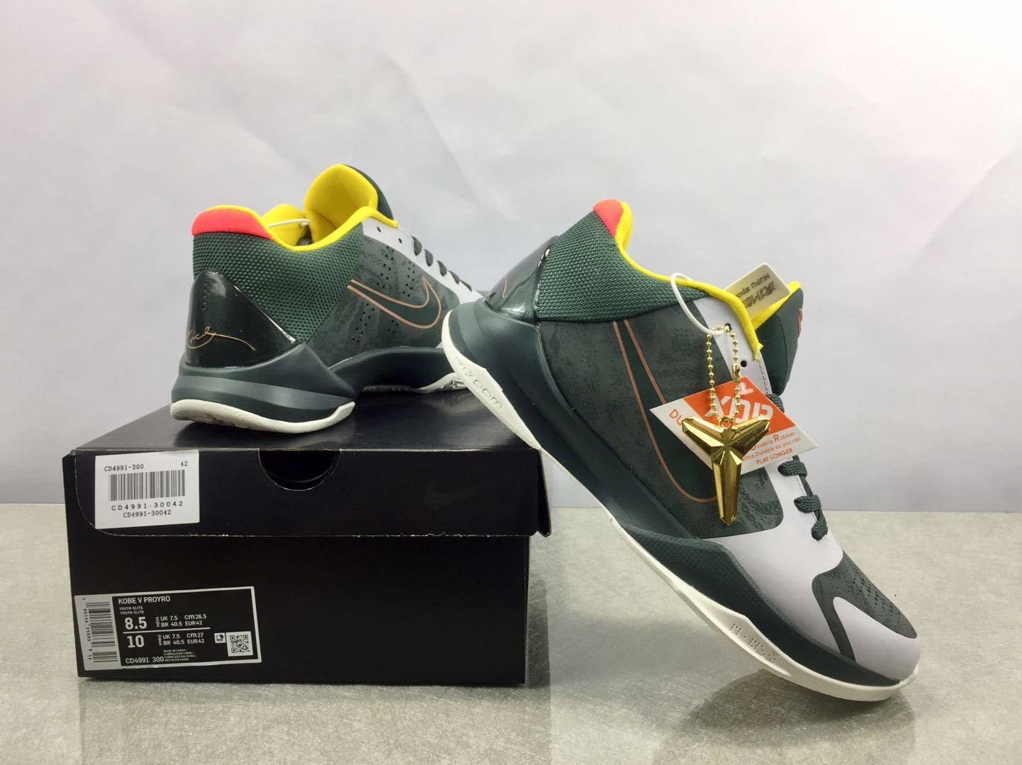 Nike Kobe 5 Protro EYBL basketball shoes in vibrant multicolor tournament-inspired design
