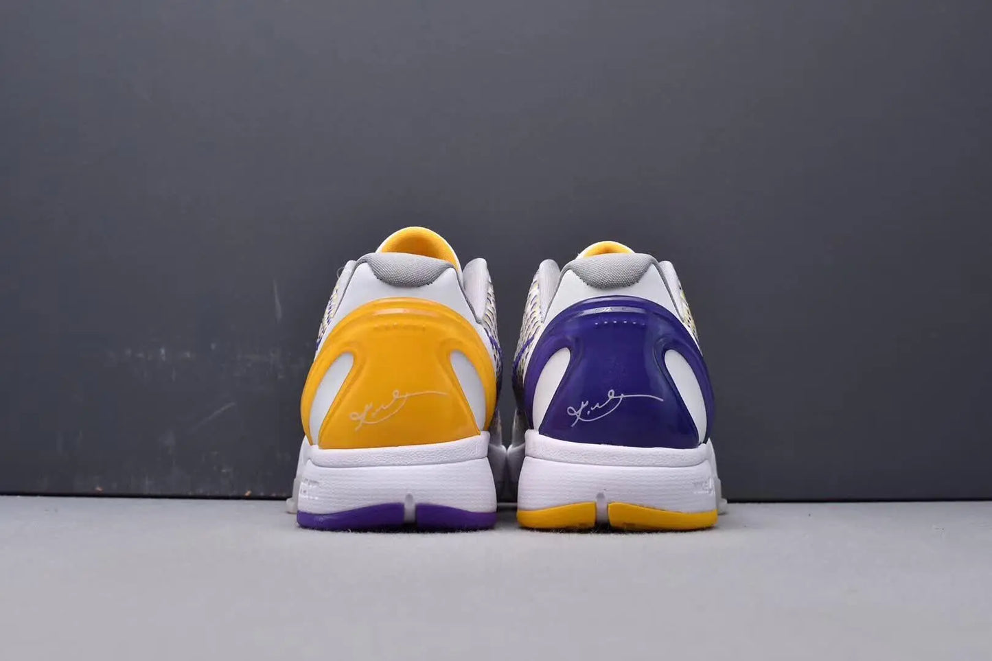 Purple and gold Kobe 6 sneakers with 3D Lakers logo design