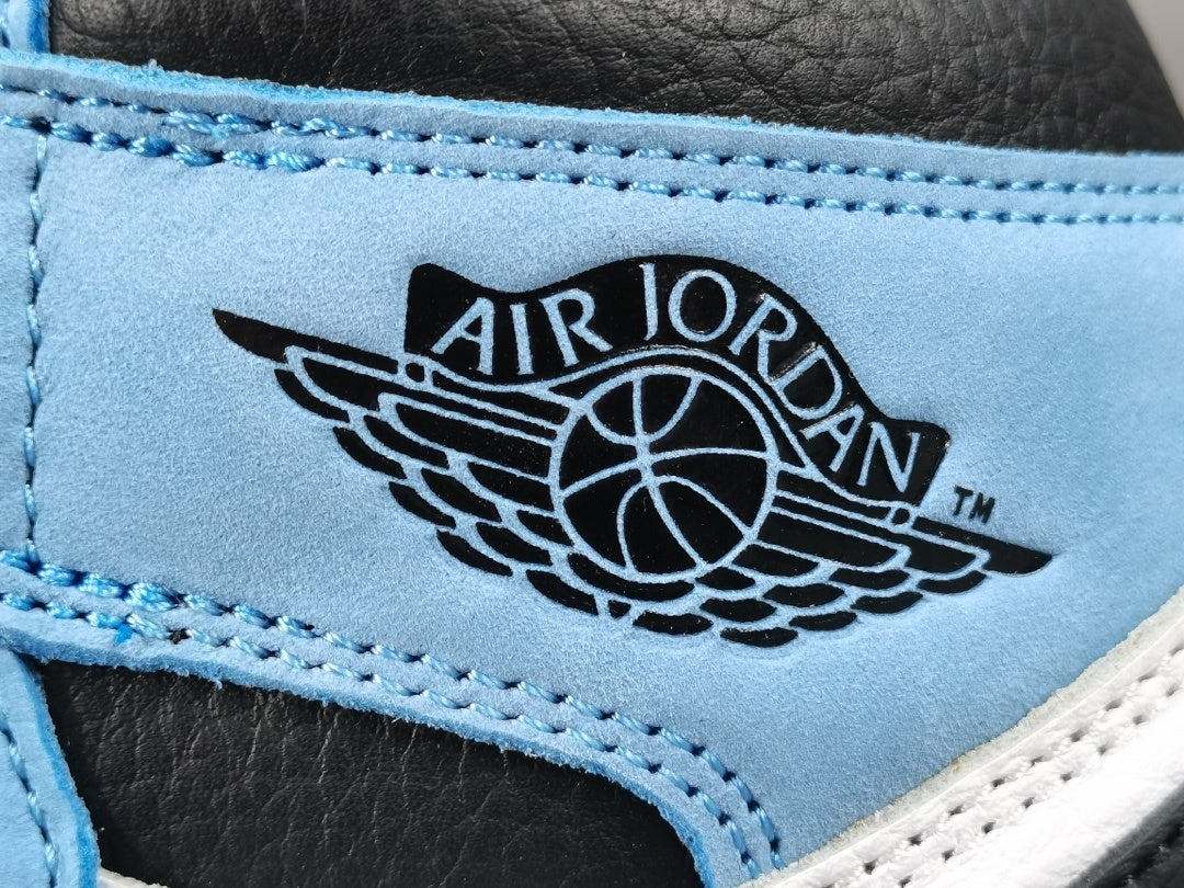 Jordan 1 Retro High OG University Blue sneakers with suede overlays and classic style.