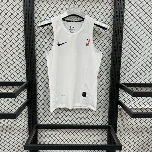 A white Nike basketball jersey with black shoulder patches and NBA logo, hanging on a black metal mesh display rack.
