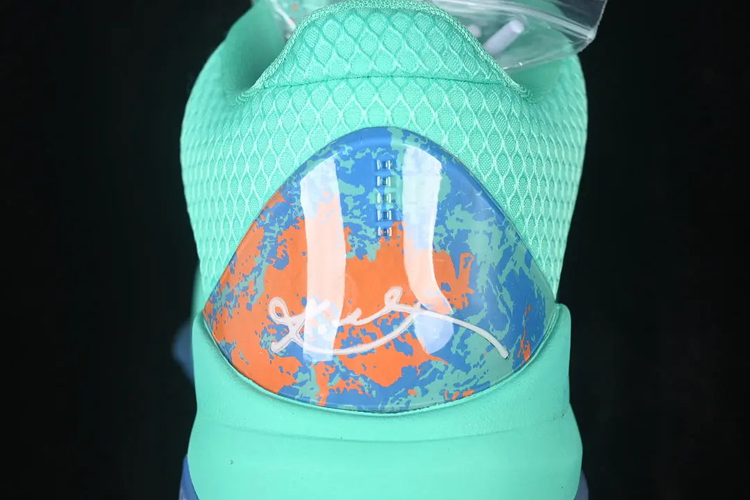 Heel of Nike Kobe 5 Protro Jalen Brunson NY vs NY PE highlighting orange Horizon paint splatters and Kobe sheath logo