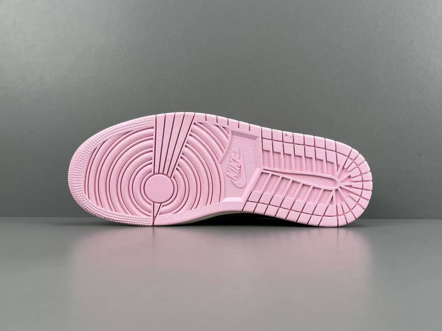 Jordan 1 Low Travis Scott Tropical Pink sneakers with reverse Swoosh
