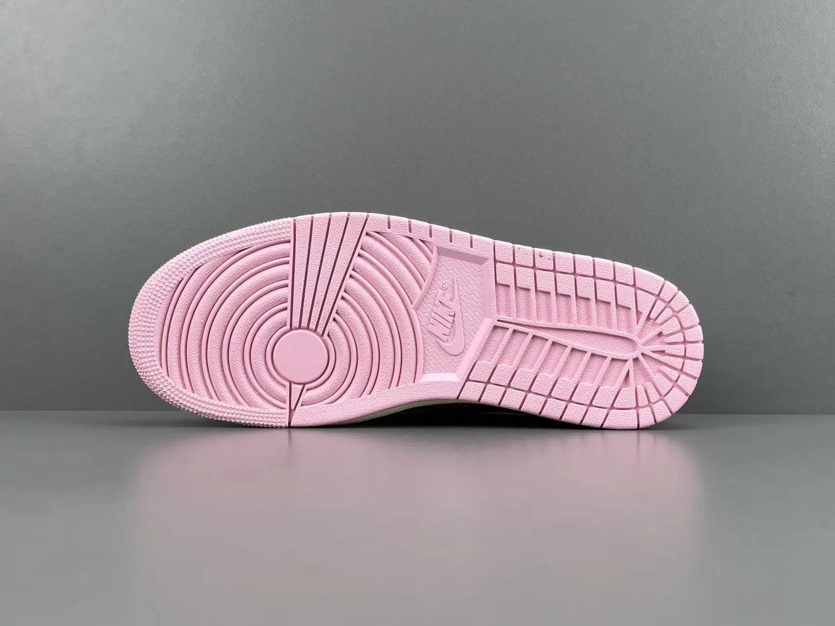 Jordan 1 Low Travis Scott Tropical Pink sneakers with reverse Swoosh
