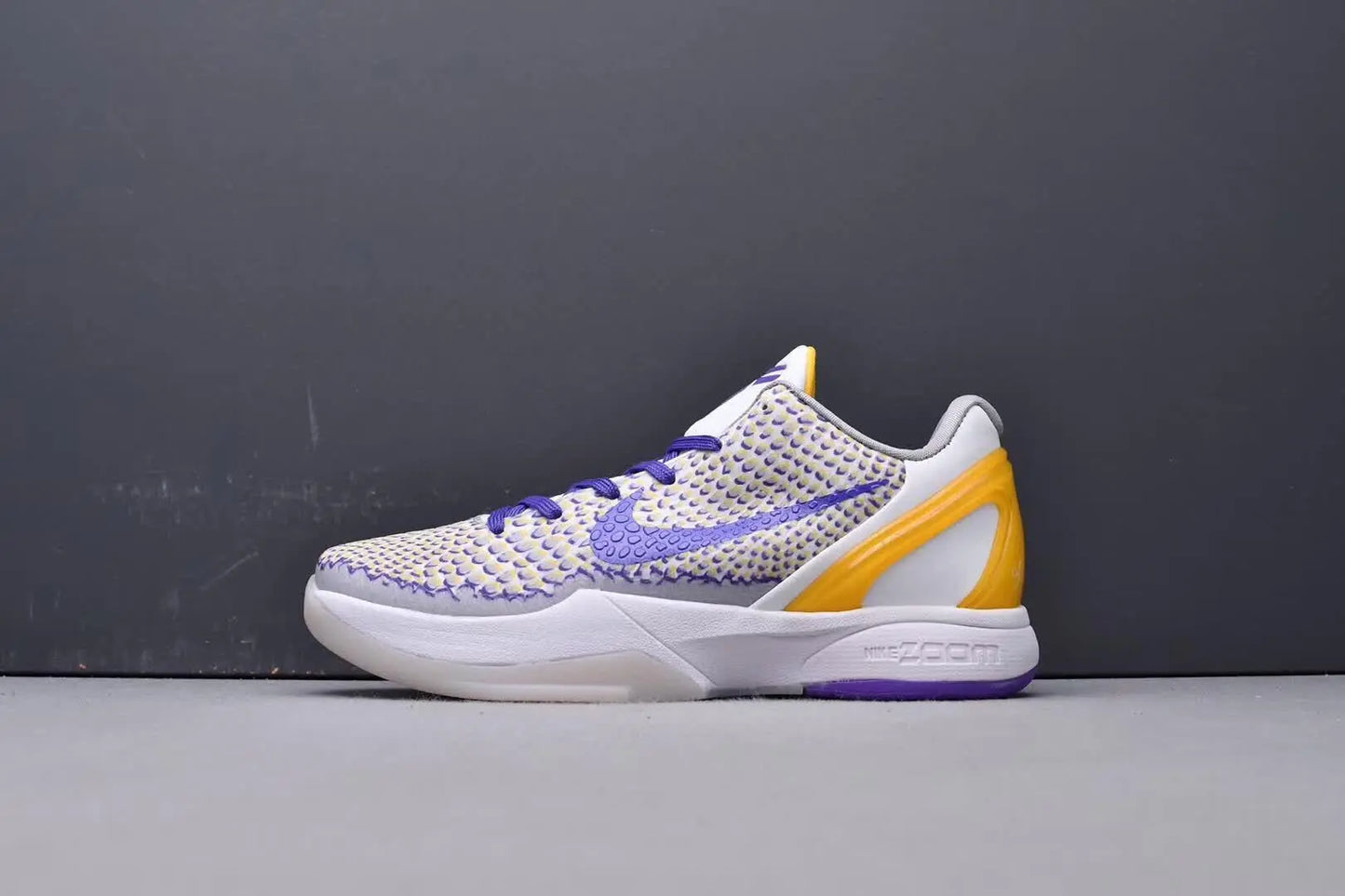 Purple and gold Kobe 6 sneakers with 3D Lakers logo design