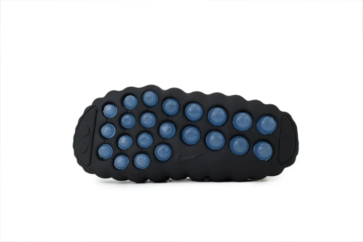 Nike Mind 001 NOCTA Slide Black Concept black rubber outsole bottom view traction pattern sole