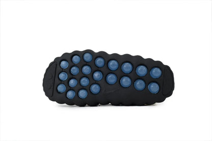 Nike Mind 001 NOCTA Slide Black Concept black rubber outsole bottom view traction pattern sole