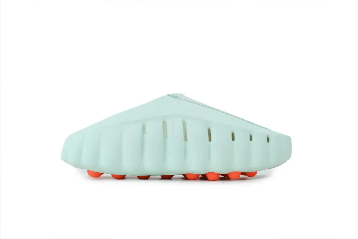 Side view of Nike Mind 001 Barley Green slides showing the thick ultra-soft foam footbed and minimalist design