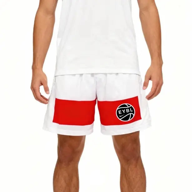 White athletic shorts with a bold red stripe across the lower front and a black circular EVBL basketball logo on the left leg, shown on a model against a white background.