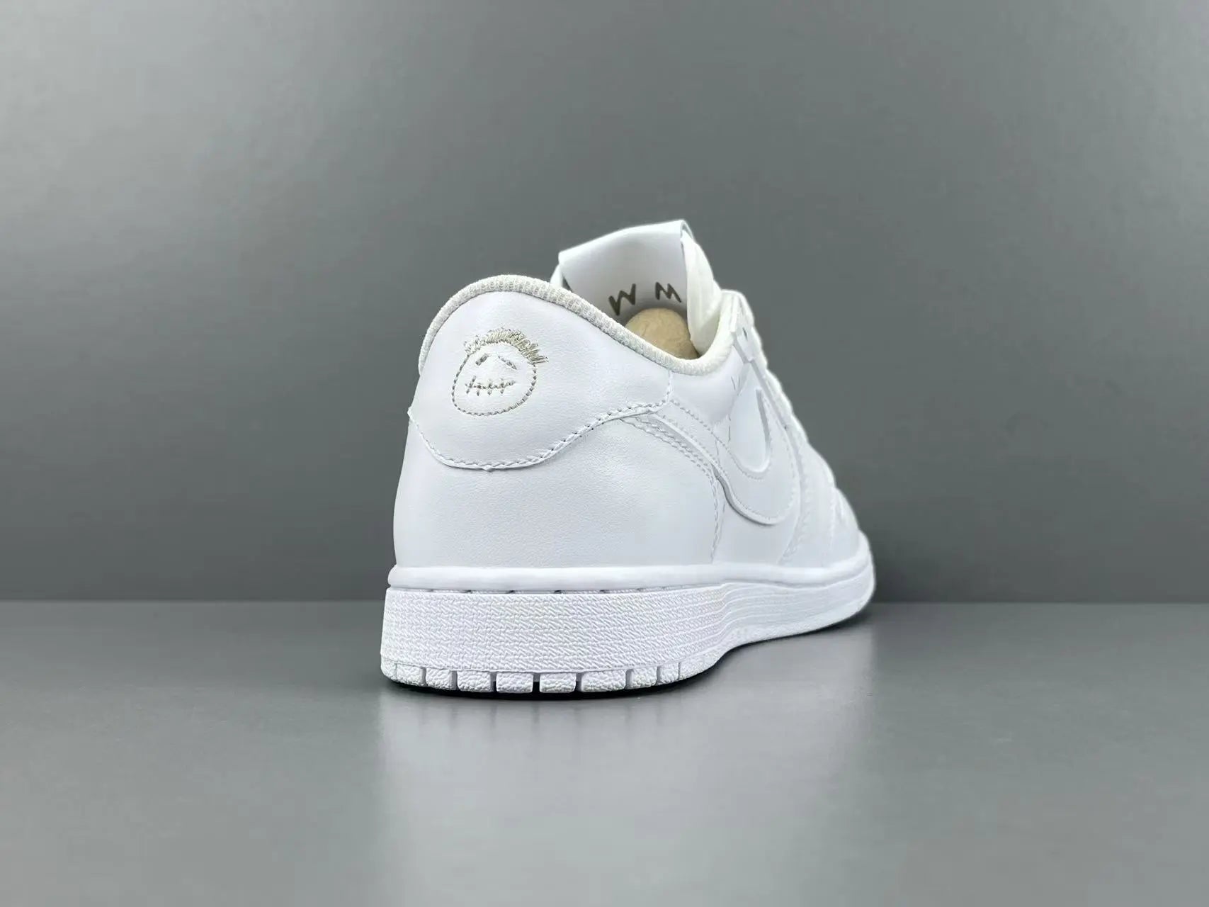 Air Jordan 1 Low Travis Scott White side view reverse Swoosh leather sneaker