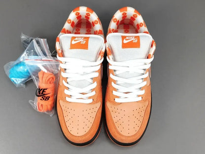 Nike SB Dunk Concepts Orange Lobster angled view showing orange suede and leather overlays