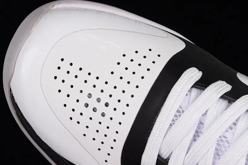 Heel detail of Nike Kobe 5 Protro White/Black basketball shoes highlighting the black heel counter, external support, and clean white-to-black color blocking