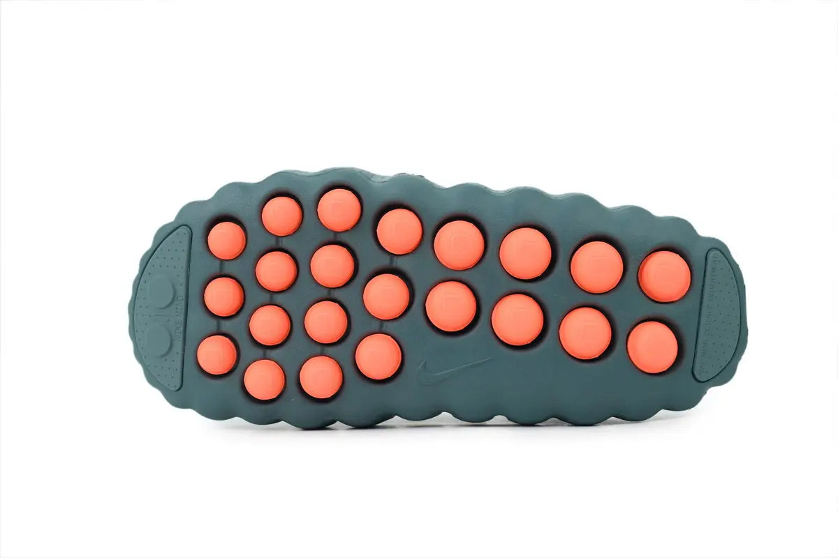 Back view of Nike Mind 001 Mineral Slate slides showing the heel design and durable construction