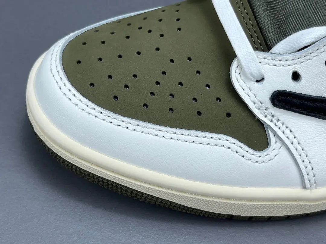 "Jordan 1 Low x Travis Scott Medium Olive sneakers with olive suede, black overlays, and reverse Swoosh."