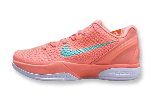 Coral Nike running shoe with a light blue swoosh logo on a white background