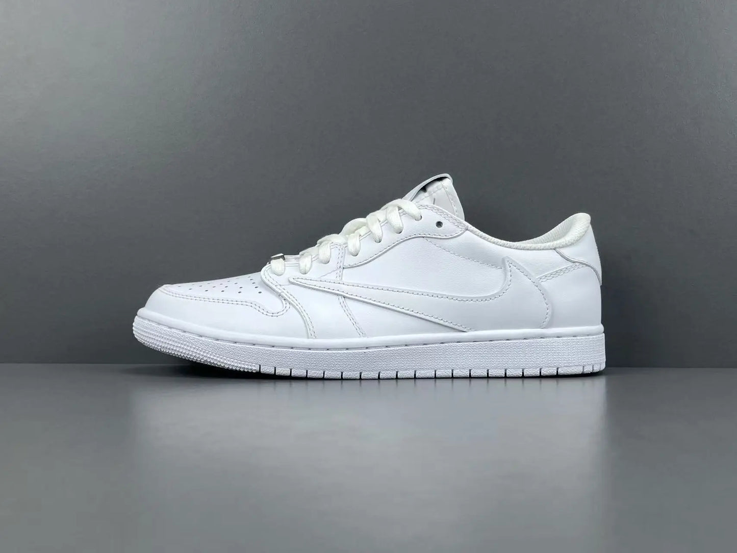 Air Jordan 1 Low Travis Scott White side view reverse Swoosh leather sneaker