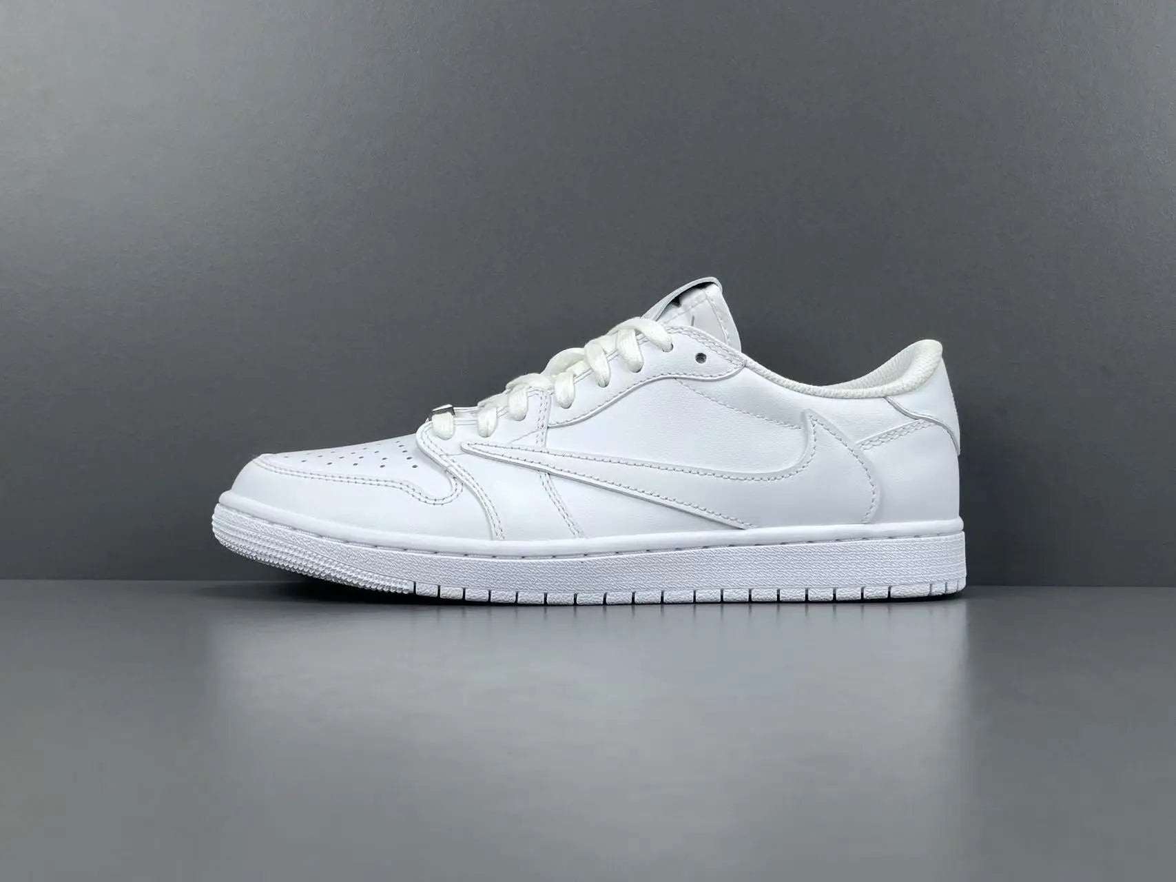 Air Jordan 1 Low Travis Scott White side view reverse Swoosh leather sneaker