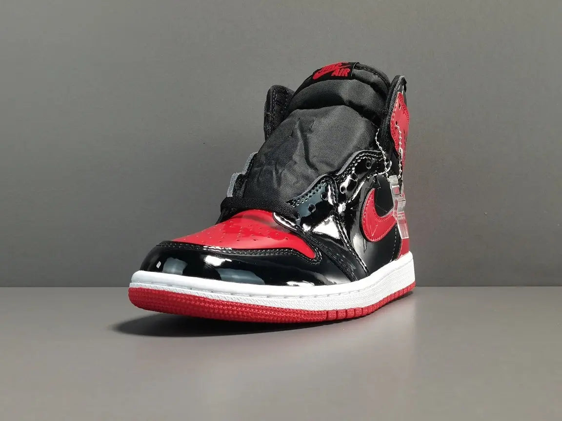 Jordan 1 Retro High Patent Bred black red patent leather sneaker
