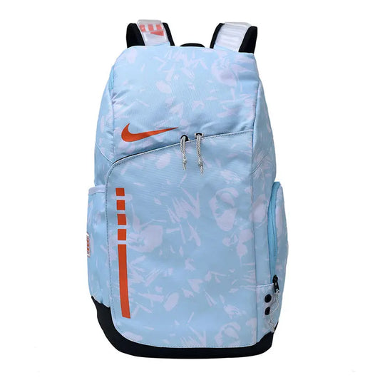 A light blue Nike backpack with an abstract white pattern, orange swoosh logo, and orange vertical stripe detail on the front pocket, shown against a plain white background.