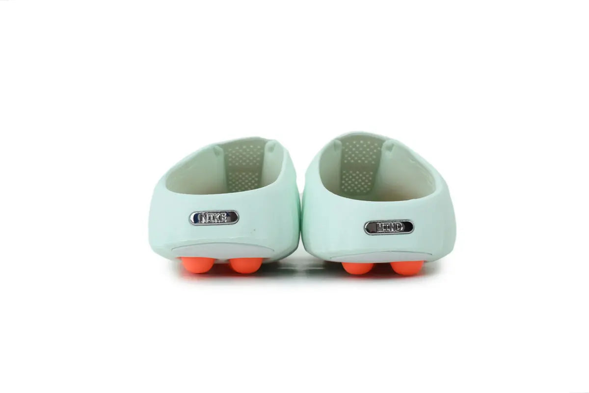 Back view of Nike Mind 001 Barley Green slides highlighting the heel design and durable construction