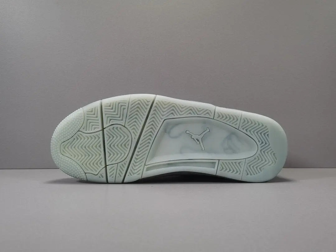 Light green sneaker sole with brand logo on a gray background