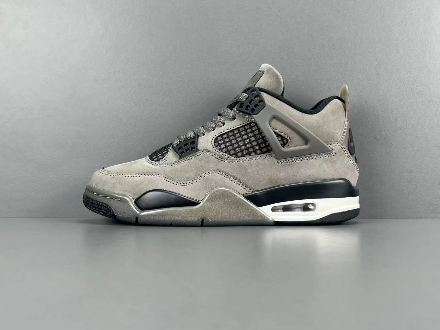 Air Jordan 4 x Cave Stone sneakers featuring premium materials neutral tones
