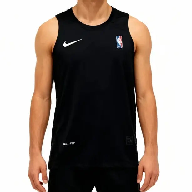 A man wearing a black Nike Dri-FIT basketball practice tank top with a white swoosh and an NBA logo on the chest, shown against a plain white background.