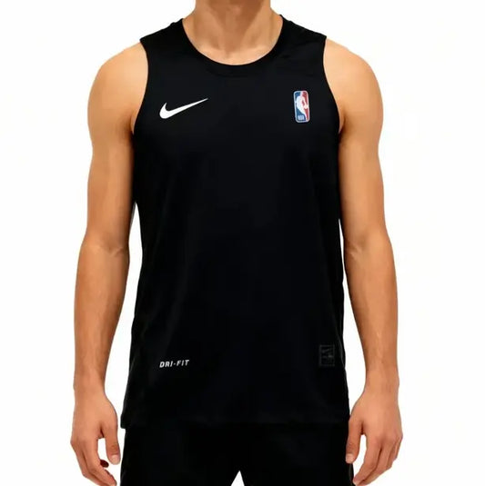 A man wearing a black Nike Dri-FIT basketball practice tank top with a white swoosh and an NBA logo on the chest, shown against a plain white background.