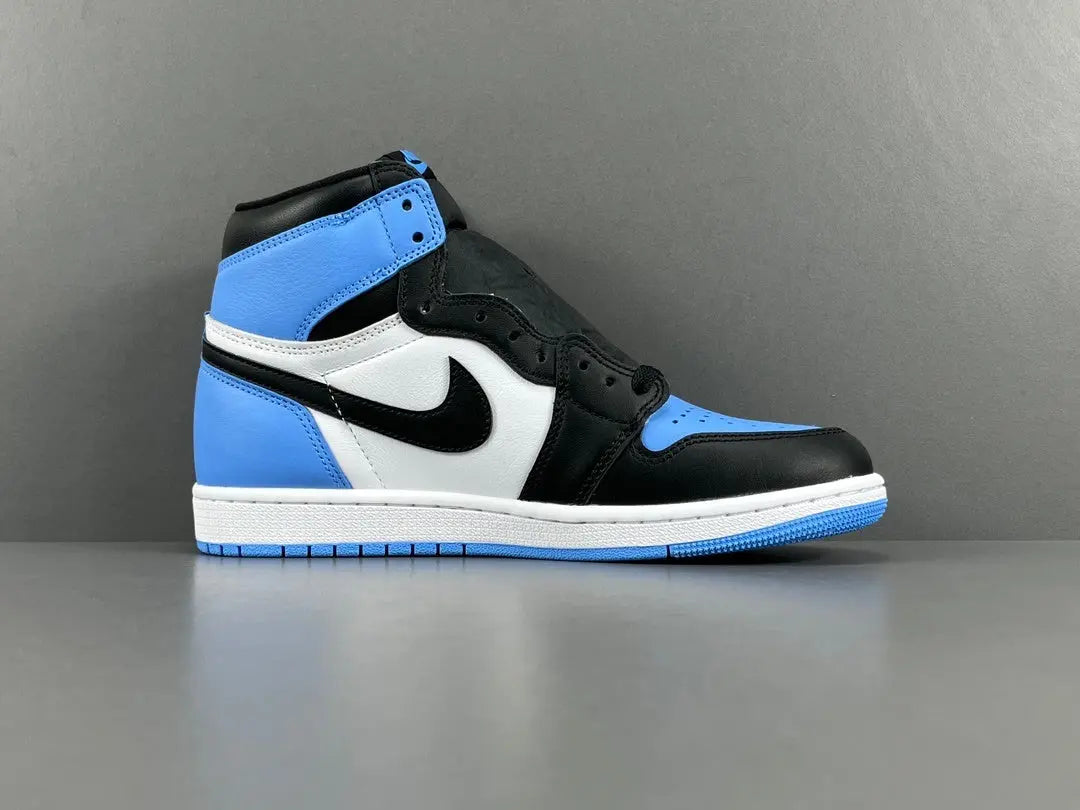 Air Jordan 1 High OG UNC Toe side view black white university blue sneaker