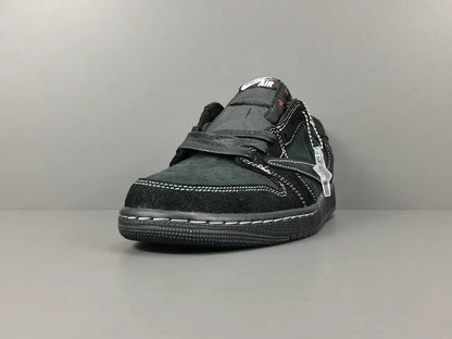 "Jordan 1 Low Travis Scott Phantom with black nubuck, white stitching, and signature reverse Swoosh."