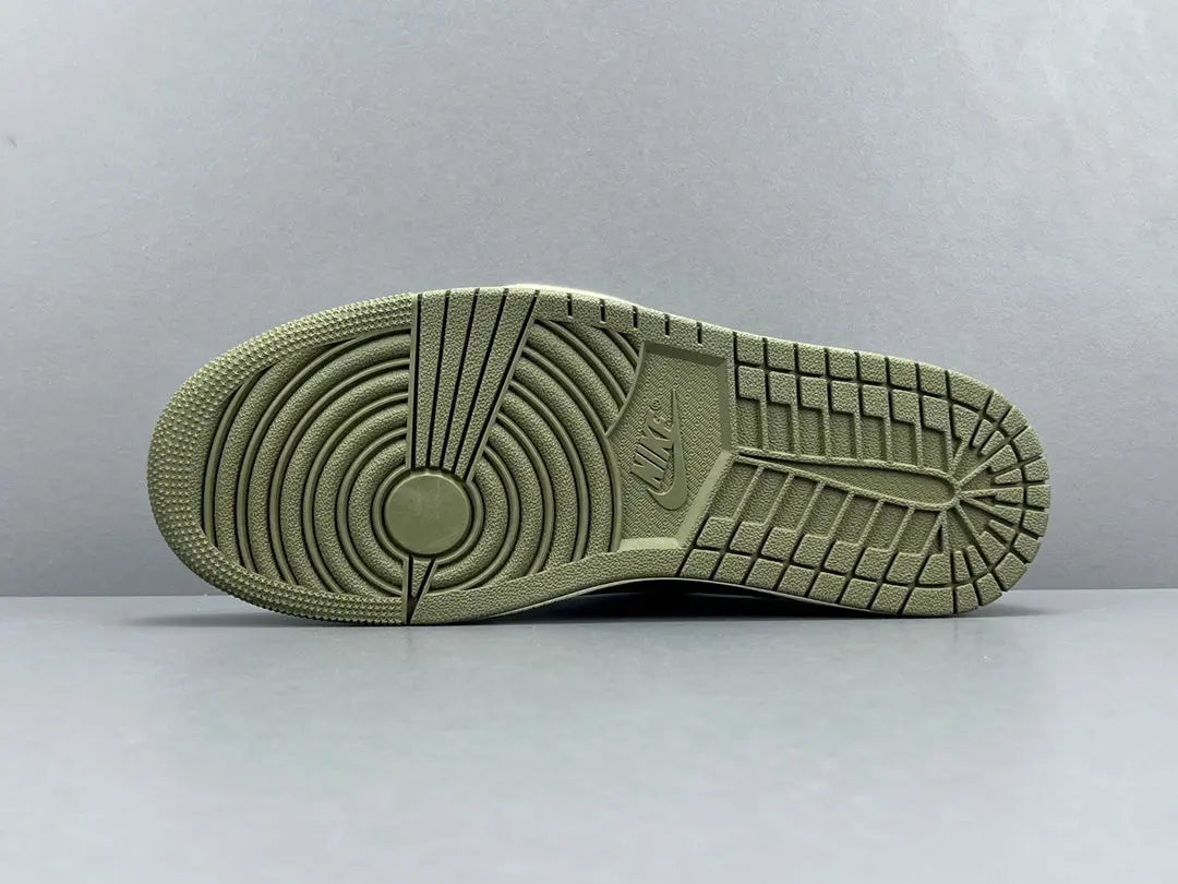 "Jordan 1 Low x Travis Scott Medium Olive sneakers with olive suede, black overlays, and reverse Swoosh."