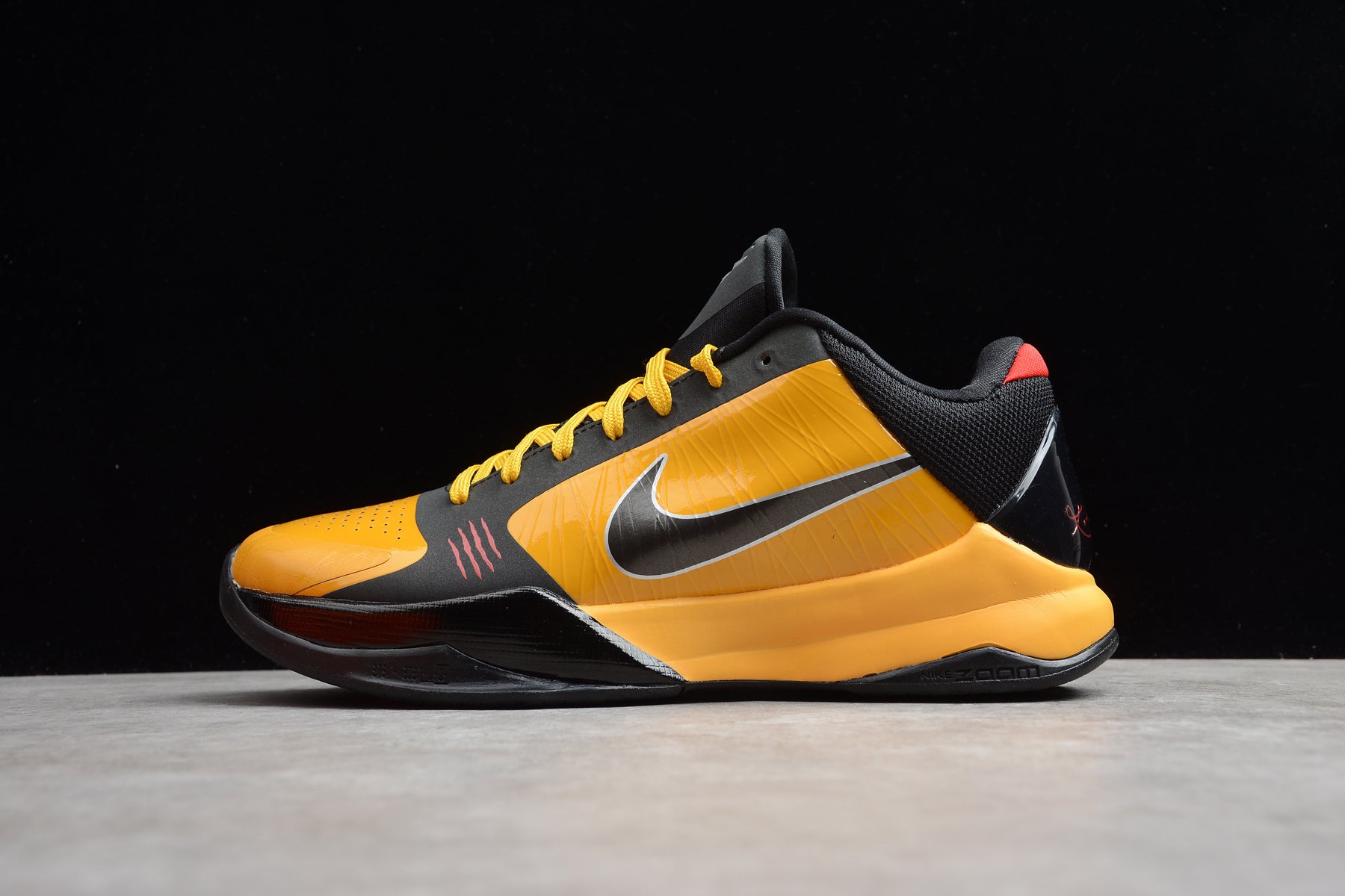 Nike Kobe 5 Protro Bruce Lee basketball shoes in yellow and black colorway
