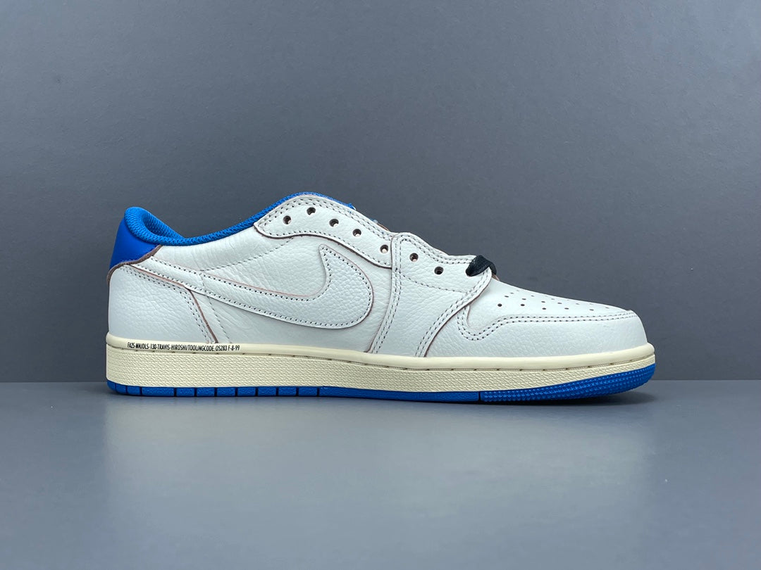 Air Jordan 1 Low OG x Travis Scott x Fragment with a white, black, and blue design, reverse Swoosh, and co-branded heel logos.